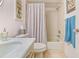 Bathroom with a tub and shower, vanity, and classic fixtures at 3382 Mermoor Dr # 3201, Palm Harbor, FL 34685