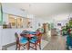 Open concept dining and living area, with a chandelier and an inviting layout with kitchen access at 3382 Mermoor Dr # 3201, Palm Harbor, FL 34685