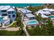 Aerial shot of luxurious home with pool, hot tub, and waterfront access at 3516 Casey Key Rd, Nokomis, FL 34275