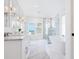 Spacious marble bathroom featuring a glass shower, soaking tub, and double vanity at 3516 Casey Key Rd, Nokomis, FL 34275