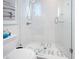 Modern bathroom featuring a glass shower with white subway tiles and 'NO DIVING' written on the shower floor at 3516 Casey Key Rd, Nokomis, FL 34275