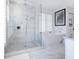 Stylish bathroom featuring glass shower, soaking tub, and modern fixtures at 3516 Casey Key Rd, Nokomis, FL 34275
