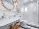 Modern bathroom featuring glass shower, ship-style mirror and sink, 'NO DIVING' shower floor at 3516 Casey Key Rd, Nokomis, FL 34275