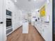 Modern kitchen features stainless steel appliances, a center island, and ample cabinet space at 3516 Casey Key Rd, Nokomis, FL 34275