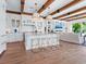 Gourmet kitchen with marble countertops, stainless steel appliances, and breakfast bar at 3516 Casey Key Rd, Nokomis, FL 34275