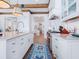 Well-equipped kitchen boasts a center island, modern appliances, and stylish cabinets in a bright, open space at 3516 Casey Key Rd, Nokomis, FL 34275