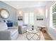 Cozy living room with comfortable seating and beachy decor at 3516 Casey Key Rd, Nokomis, FL 34275