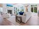 Cozy living room with fireplace, comfortable seating, and elegant decor at 3516 Casey Key Rd, Nokomis, FL 34275