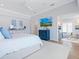 Bright main bedroom with tray ceilings and ensuite sitting area at 3516 Casey Key Rd, Nokomis, FL 34275