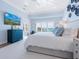 Serene main bedroom with blue accents, tray ceiling, and ocean views for a relaxing retreat at 3516 Casey Key Rd, Nokomis, FL 34275