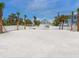 Spacious parking area near a pristine beach, providing convenient access and additional space for outdoor activities and recreation at 3516 Casey Key Rd, Nokomis, FL 34275