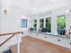 Hall sitting area with built-in bench seating and natural light at 3516 Casey Key Rd, Nokomis, FL 34275