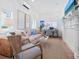 Cozy sitting room with comfortable seating, decorative fireplace, and natural light, perfect for relaxation at 3516 Casey Key Rd, Nokomis, FL 34275