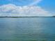 Expansive water view showcasing the tranquil beauty of the bay, offering a serene backdrop for relaxation and reflection at 3516 Casey Key Rd, Nokomis, FL 34275
