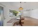 Breakfast nook with wood table, pendant light, bay window, and built-in bench seating at 381 La Playa Ln, Port Charlotte, FL 33953