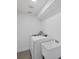 Bright laundry room with a sink, a washer and a dryer at 381 La Playa Ln, Port Charlotte, FL 33953