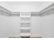 Spacious walk-in closet with built in shelving and clothing racks provides ample storage solutions at 381 La Playa Ln, Port Charlotte, FL 33953