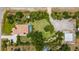 Expansive property with pool, complemented by lush landscaping and a large, well-maintained yard at 3950 Pepper Ln, North Port, FL 34287
