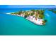 Beautiful aerial view of a waterfront park with beach access and parking overlooking the turquoise waters at 3950 Pepper Ln, North Port, FL 34287