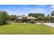 Charming single-story home boasts a well-manicured lawn and tropical landscaping at 3950 Pepper Ln, North Port, FL 34287