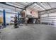 Large garage interior view, featuring a two-story layout with workshop equipment and ample open space at 3950 Pepper Ln, North Port, FL 34287