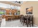 Open kitchen features granite countertops, stainless steel appliances, and a large island with seating at 3950 Pepper Ln, North Port, FL 34287