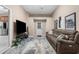 Spacious living room with comfortable sofa and TV at 3950 Pepper Ln, North Port, FL 34287