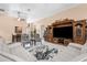 Comfortable living room showcases tile floors, stylish decor, and a large entertainment center at 3950 Pepper Ln, North Port, FL 34287