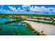 Aerial view of a marina with boats docked, near a residential area and green spaces at 3950 Pepper Ln, North Port, FL 34287