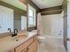Bathroom with neutral colors, a shower/tub combo, and a light wood vanity at 4103 Kinlock St, North Port, FL 34286