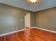 Bedroom featuring hardwood floors, neutral paint, and a doorway to another room at 4103 Kinlock St, North Port, FL 34286