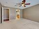 Spacious bedroom featuring a ceiling fan, neutral walls, and ample closet space at 4103 Kinlock St, North Port, FL 34286