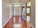 Warm and inviting foyer featuring gleaming hardwood floors and ample natural light, creating a welcoming entrance at 4103 Kinlock St, North Port, FL 34286