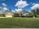 Well-maintained home with a spacious front yard, lush landscaping and a convenient two-car garage at 4103 Kinlock St, North Port, FL 34286