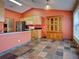 Charming kitchen with light wood cabinetry, stainless steel appliances, and a cozy dining area for casual meals at 4103 Kinlock St, North Port, FL 34286