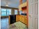 Bright kitchen area with granite countertops, stainless appliances, and natural light from a large window at 4103 Kinlock St, North Port, FL 34286
