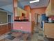 Well-designed kitchen with granite countertops, stainless steel appliances, and open access to a stylish living area at 4103 Kinlock St, North Port, FL 34286