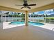 Sparkling pool surrounded by a screened enclosure providing a serene outdoor oasis for relaxation and recreation at 4103 Kinlock St, North Port, FL 34286