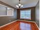 Comfortable dining area featuring hardwood floors, natural light, and modern chandelier at 4103 Kinlock St, North Port, FL 34286