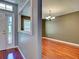 Cozy dining room featuring hardwood floors and view into entry at 4103 Kinlock St, North Port, FL 34286