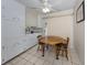 Cozy dining area features tile flooring and an adjacent sliding glass door, enhancing natural light at 4192 Tarpon Rd, Venice, FL 34293