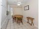 Bright dining area with tile floors and a wooden table set, perfect for casual dining at 4192 Tarpon Rd, Venice, FL 34293