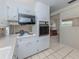 A functional kitchen area with built-in appliances and an adjacent dining space at 4192 Tarpon Rd, Venice, FL 34293