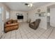 Living room with tile floors, ceiling fan, and furniture, creating a cozy and inviting space at 4192 Tarpon Rd, Venice, FL 34293
