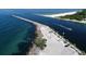 Breathtaking aerial view of turquoise waters, a scenic coastline and boaters enjoying an idyllic day on the water at 421 Cerromar Ter # 471, Venice, FL 34293