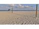 Scenic beach with a volleyball net, perfect for sports and recreation by the ocean at 421 Cerromar Ter # 471, Venice, FL 34293