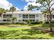 Attractive condominiums with patios and balconies are set amidst lush green lawns and palm trees at 421 Cerromar Ter # 471, Venice, FL 34293
