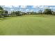 Scenic golf course view with lush green fairway, blue skies, and inviting landscape for a relaxing outdoor experience at 421 Cerromar Ter # 471, Venice, FL 34293