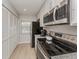 Bright kitchen featuring stainless appliances, granite countertops and lots of storage space at 421 Cerromar Ter # 471, Venice, FL 34293