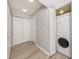 Bright laundry room with stacked washer and dryer and ample storage space for convenience at 421 Cerromar Ter # 471, Venice, FL 34293